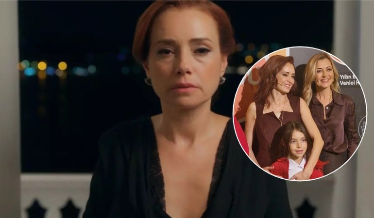 Özgü Namal kızıyla etkinlikte kameralara poz verdi